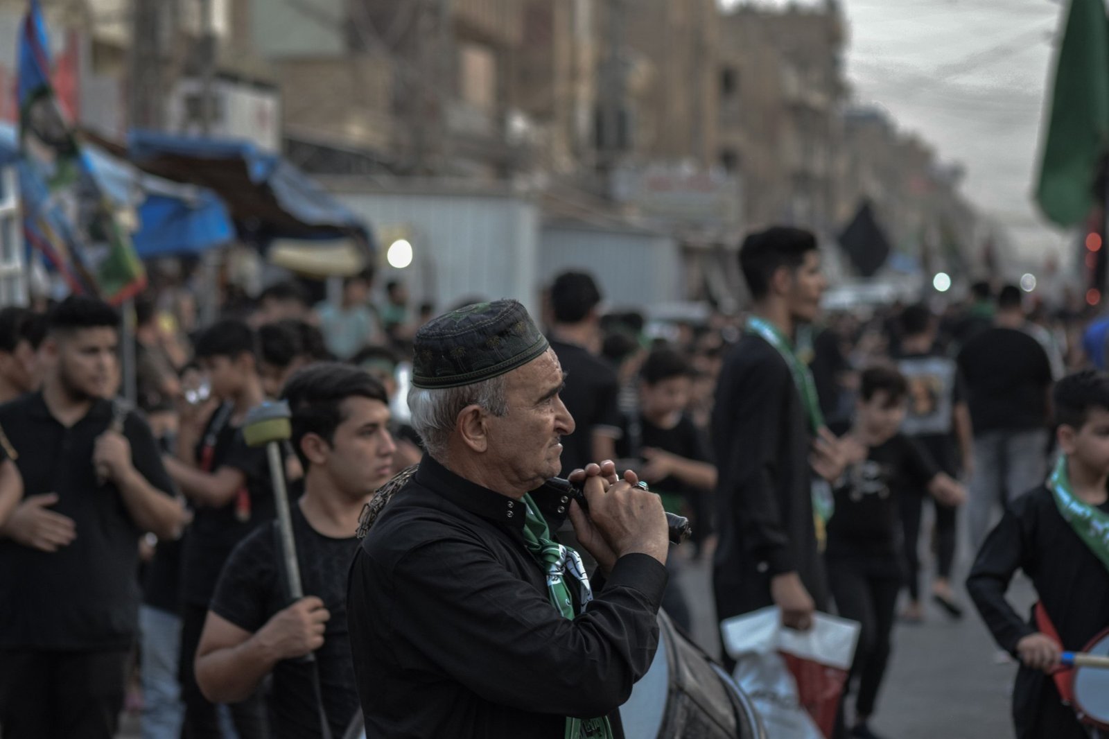 Shia mourners participating in chest-beating during an Ashura mourning procession.